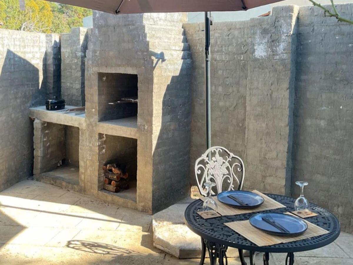 Outdoor table beside the braai